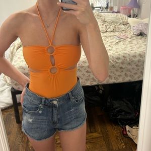 Orange bodysuit with 2 ring cutouts & side cutouts